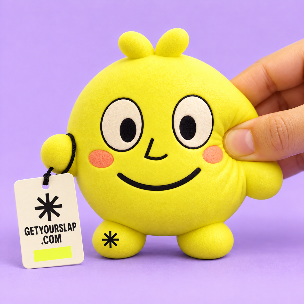 Yellow mascot squishy with a black star on its foot and an attached GETYOURSLAP.COM brand hangtag